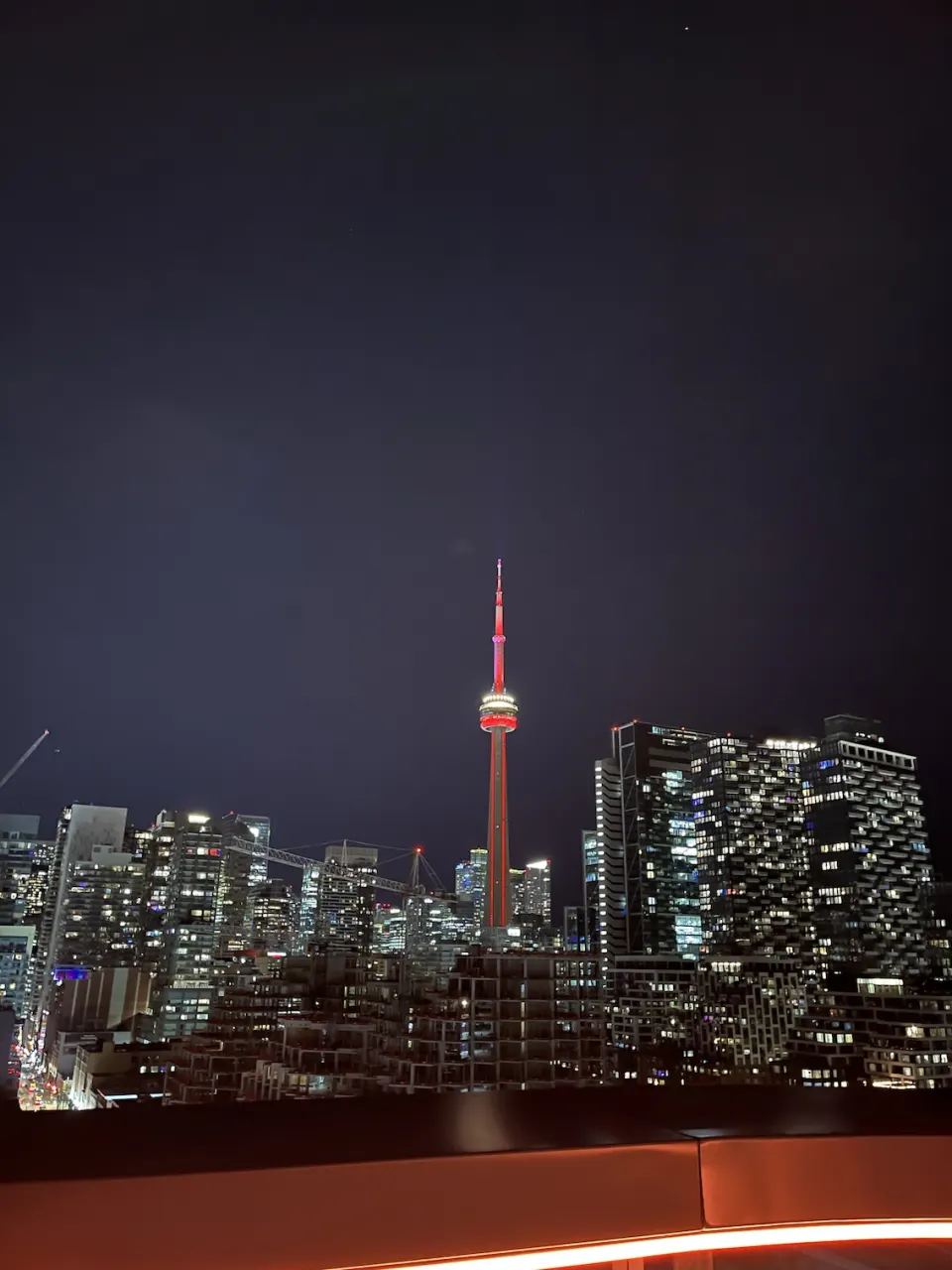 Toronto skyline and the CN Tower illuminated at night